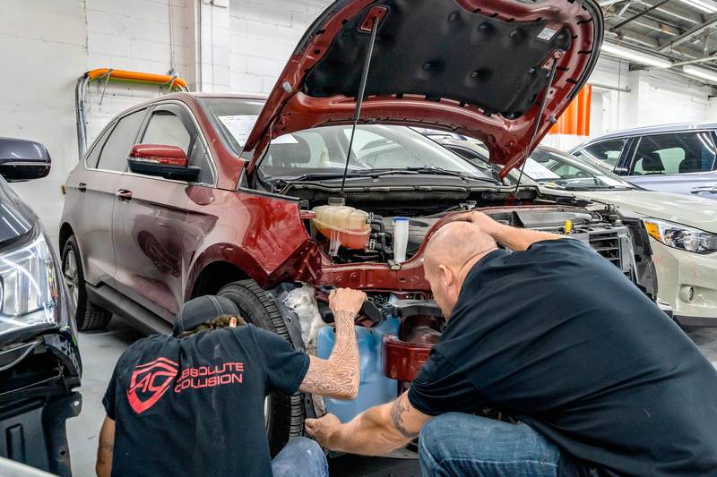 acura certified collision repair techs working